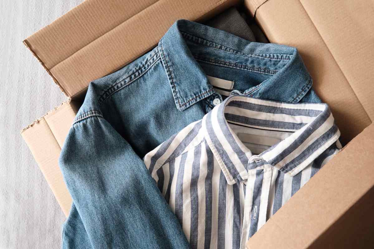 Two shirts in a sustainable cardboard box.