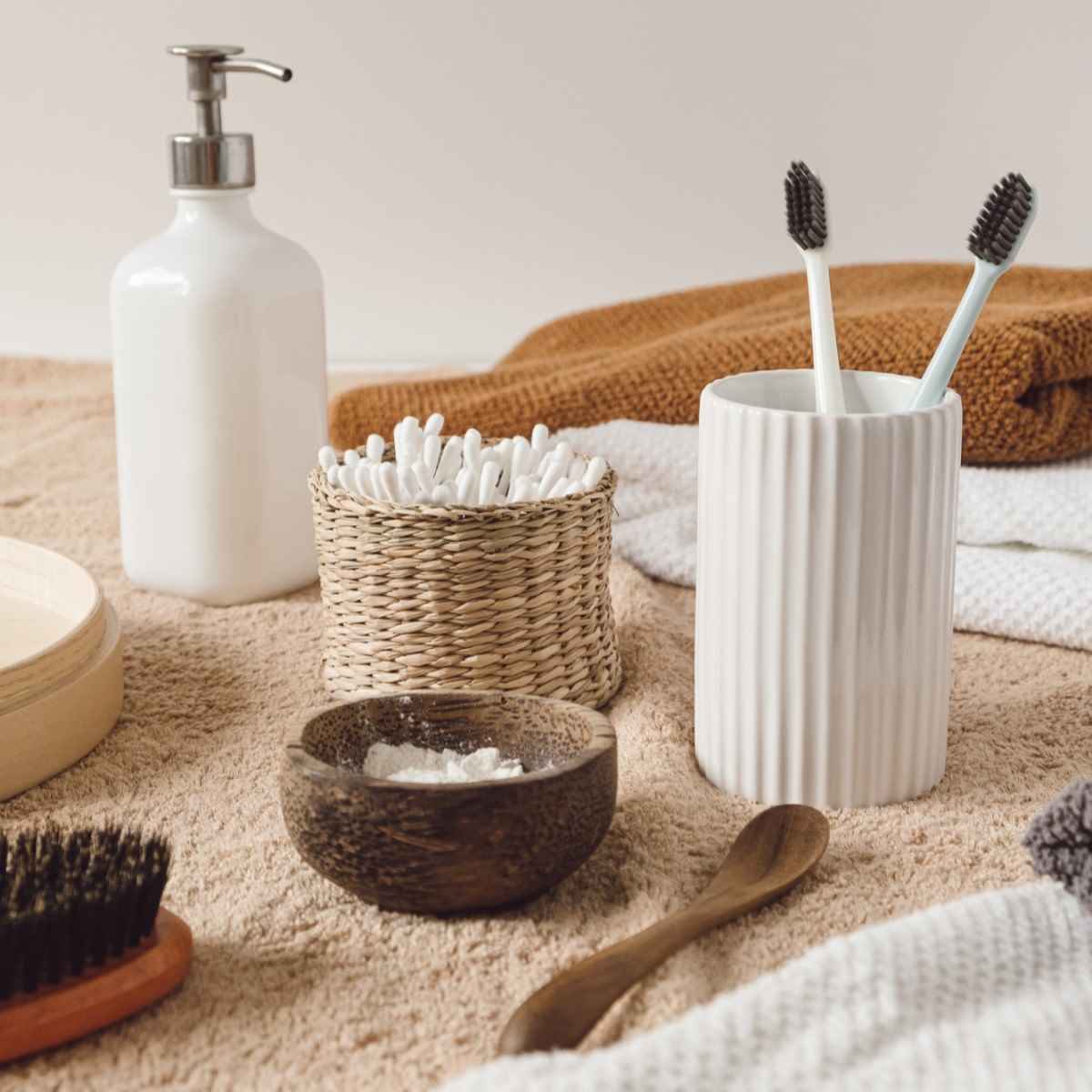 A bathroom with toothbrushes, soap, towels and other items that promote positive changes and a more sustainable lifestyle.