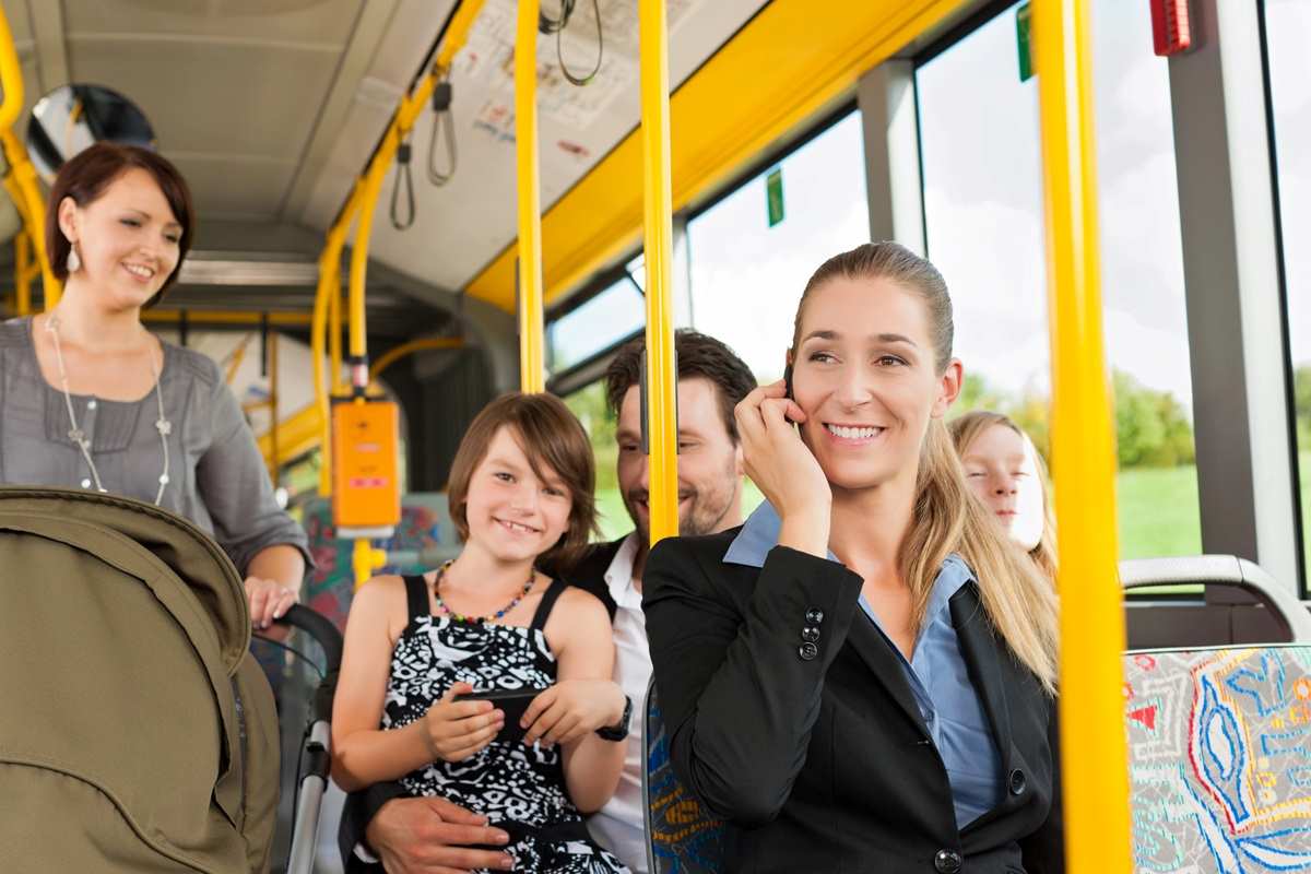 Passengers seated on a bus.